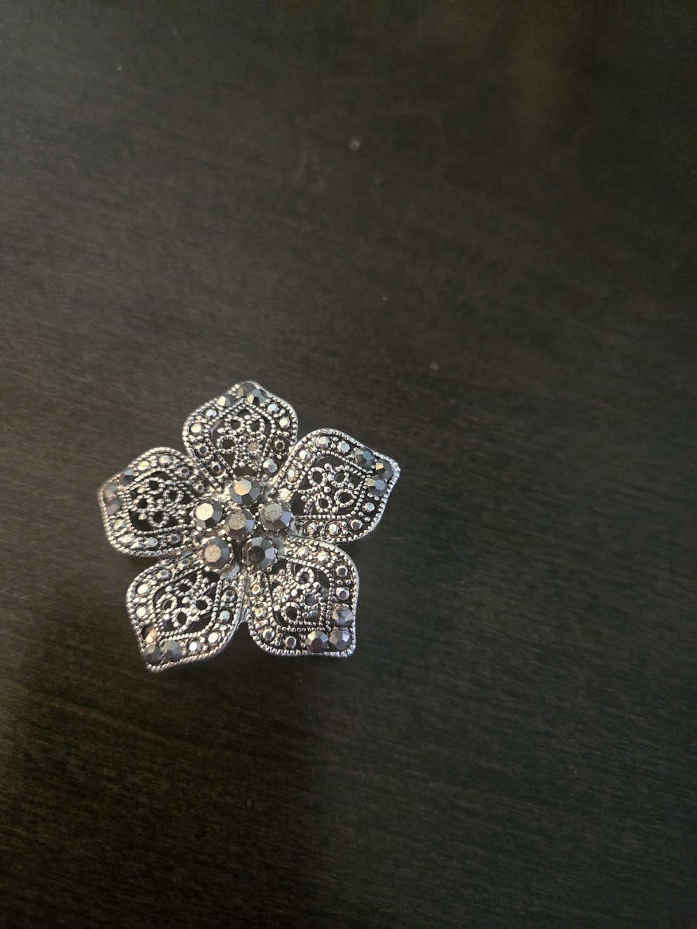 Silver Floral Filigree Brooch with Hematite Accents
